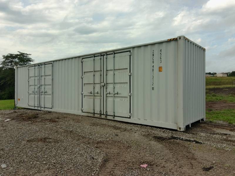 White multi-door shipping container in the CCC Equipment auction yard